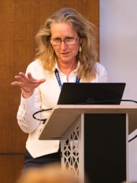 Dr Sarah Hoim speaking at a conference